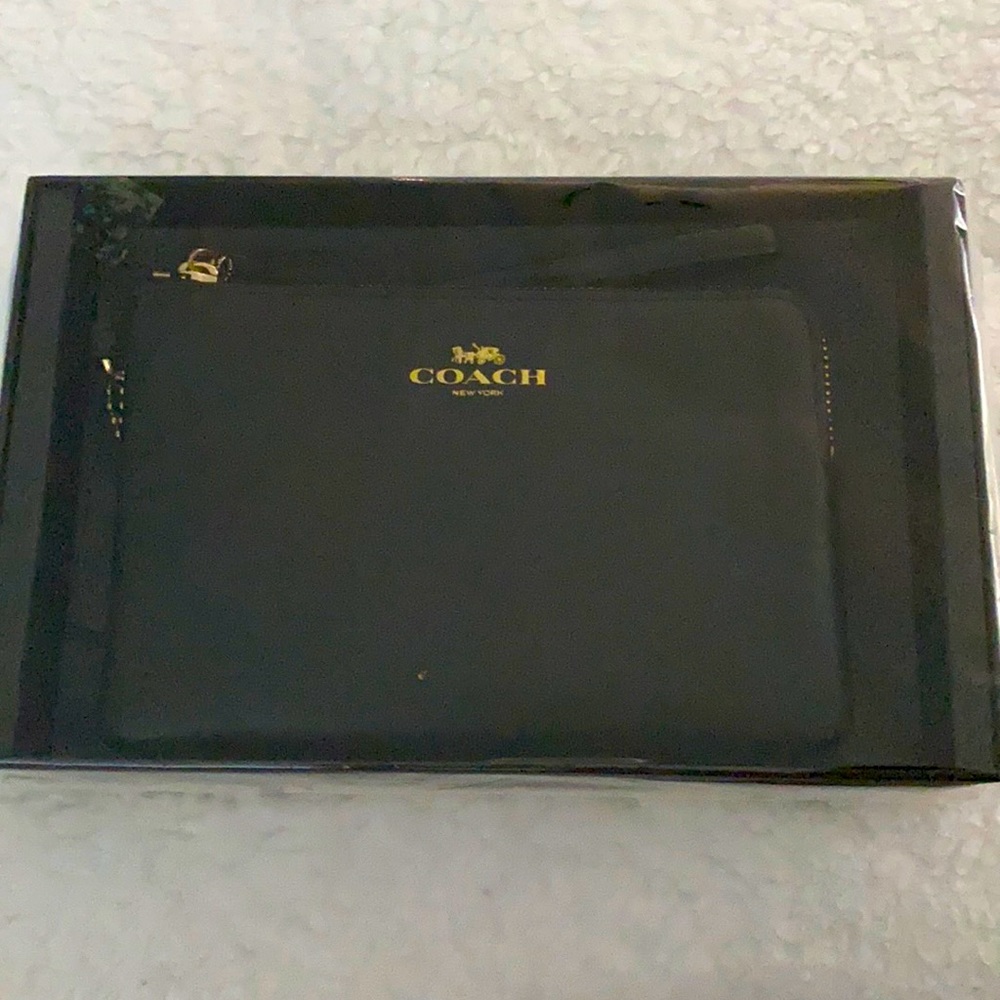 Black coach leather wristlet.